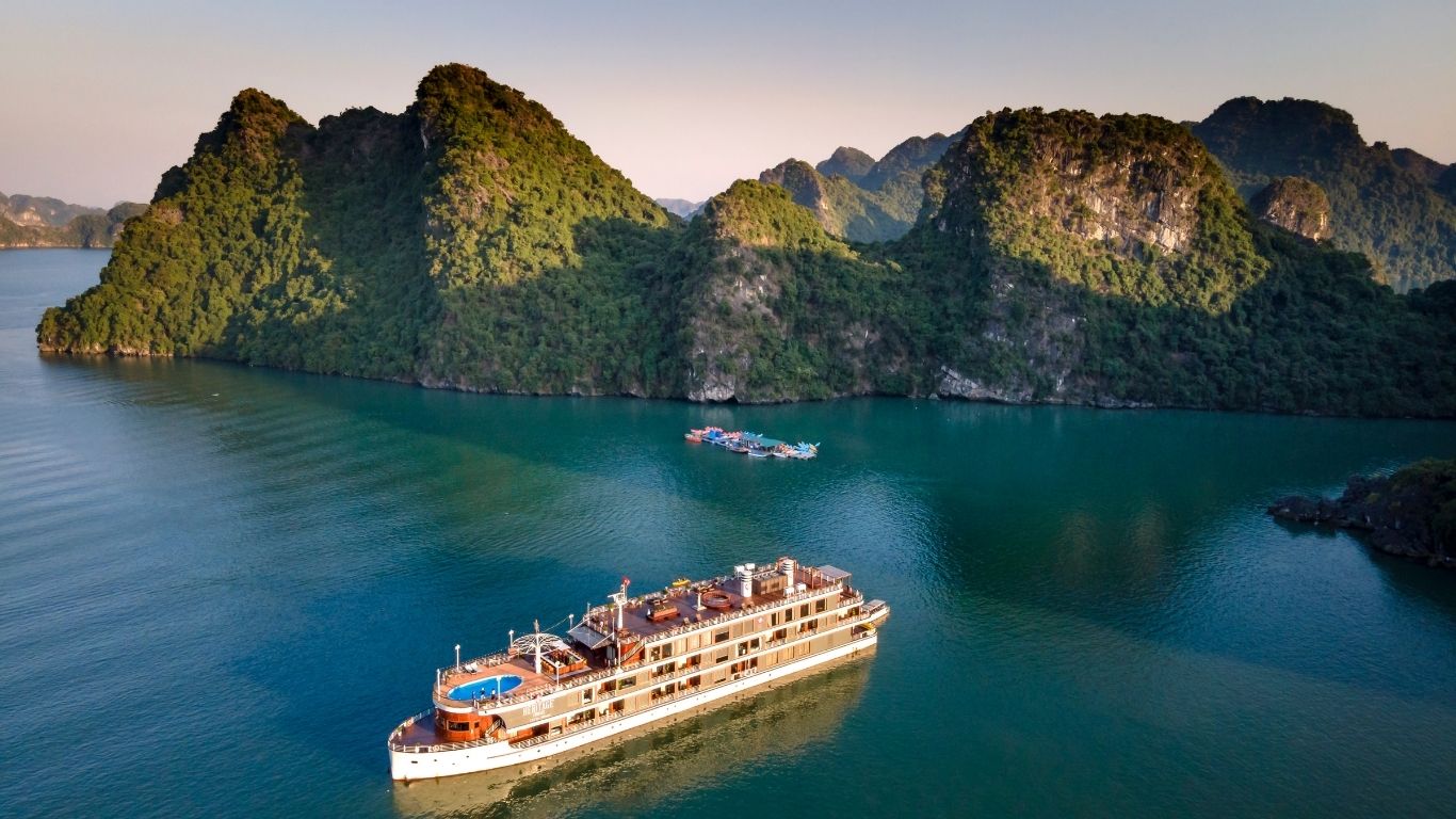 Sail through the emerald waters of Ha Long Bay on a luxurious overnight cruise