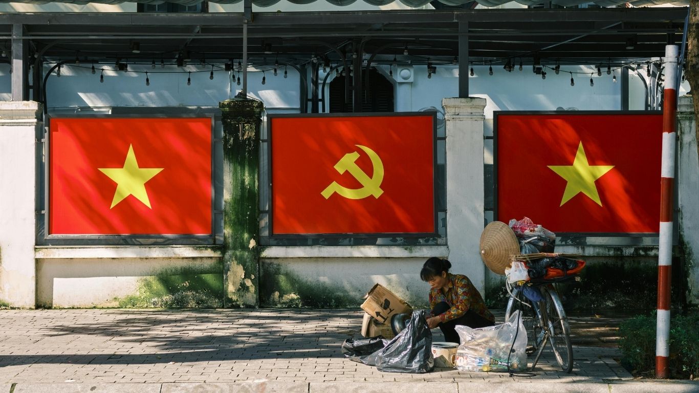 Vietnam flags displayed across streets and buildings in Hanoi