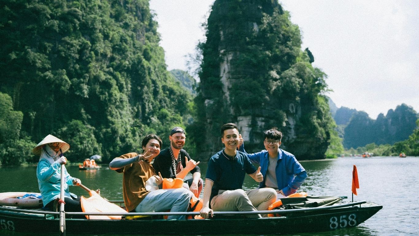 A boat ride in Tam Cốc is a peaceful journey into Vietnam’s lush countryside and cave-strewn waterways