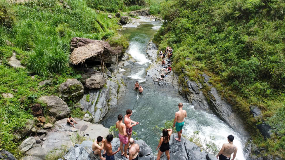 Swim under the cascade at Du Gia Waterfall