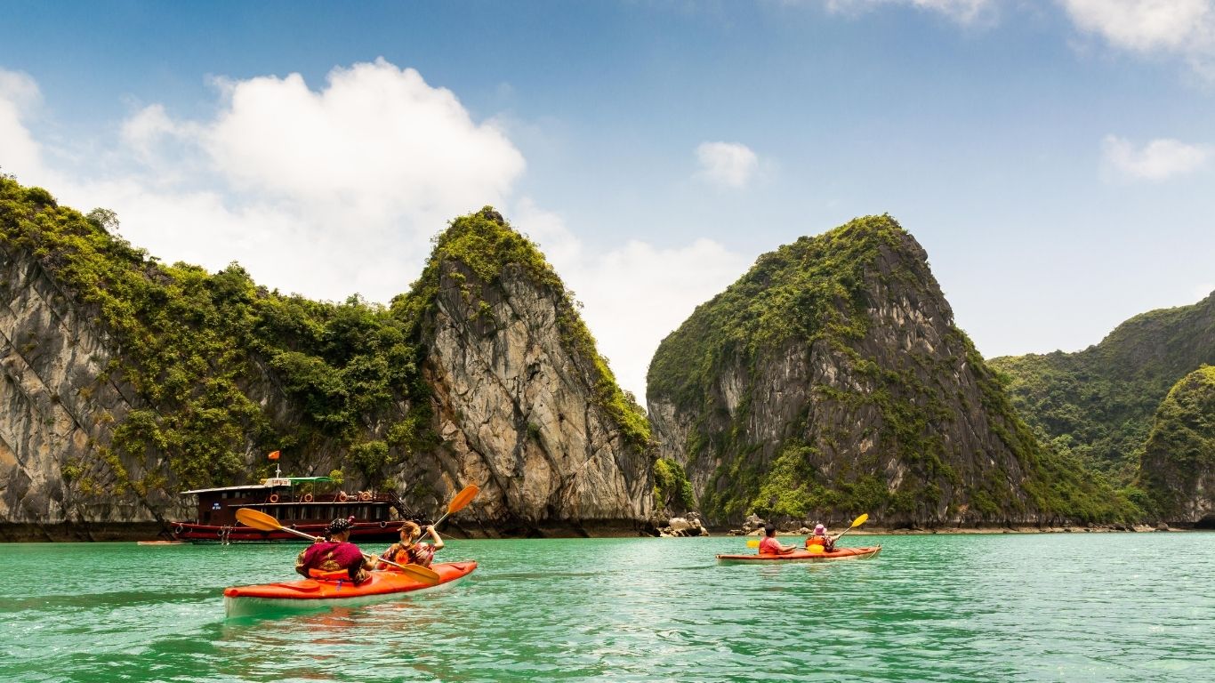 Paddle through hidden lagoons and caves on a kayaking adventure in Ha Long Bay