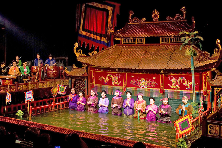 Watch the iconic Hanoi water puppet show - a unique Vietnamese art form that brings legends and rural life to life on water