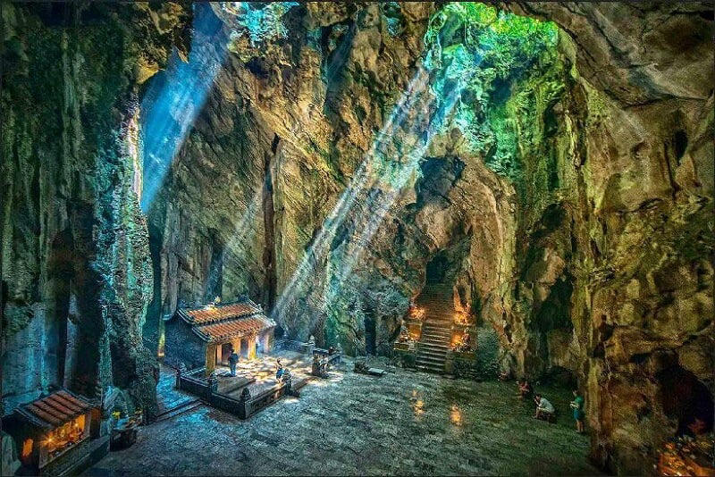 Light beams through Huyen Khong Cave, creating a serene spiritual scene in Da Nang