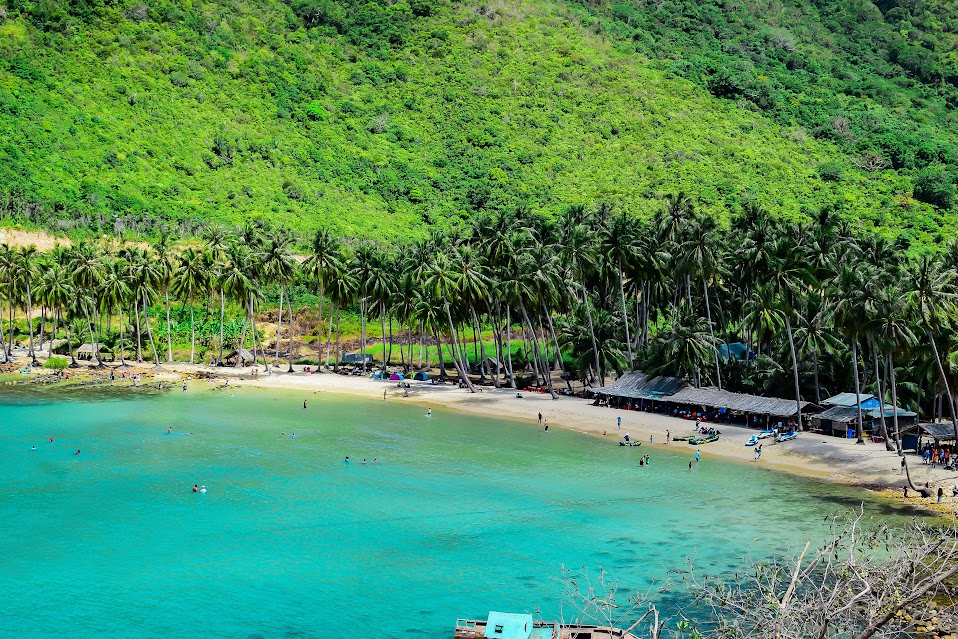 Crystal-clear waters and palm-lined shores of Nam Du Island, Vietnam