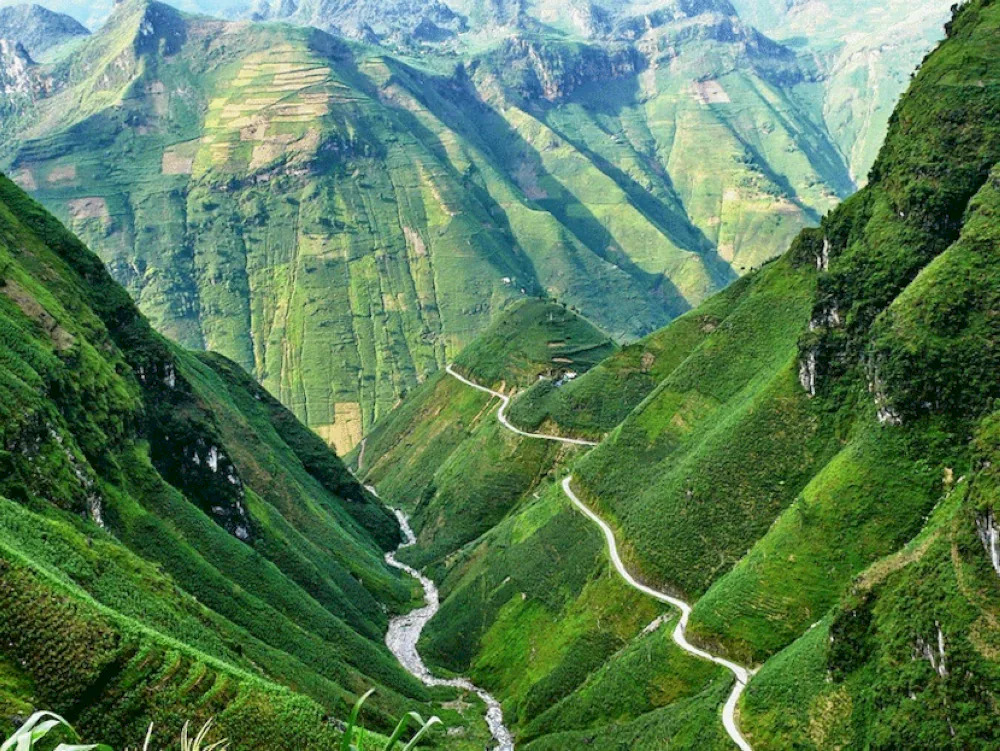 The winding road to Quan Ba Heaven Gate offers dramatic mountain views and fresh highland air