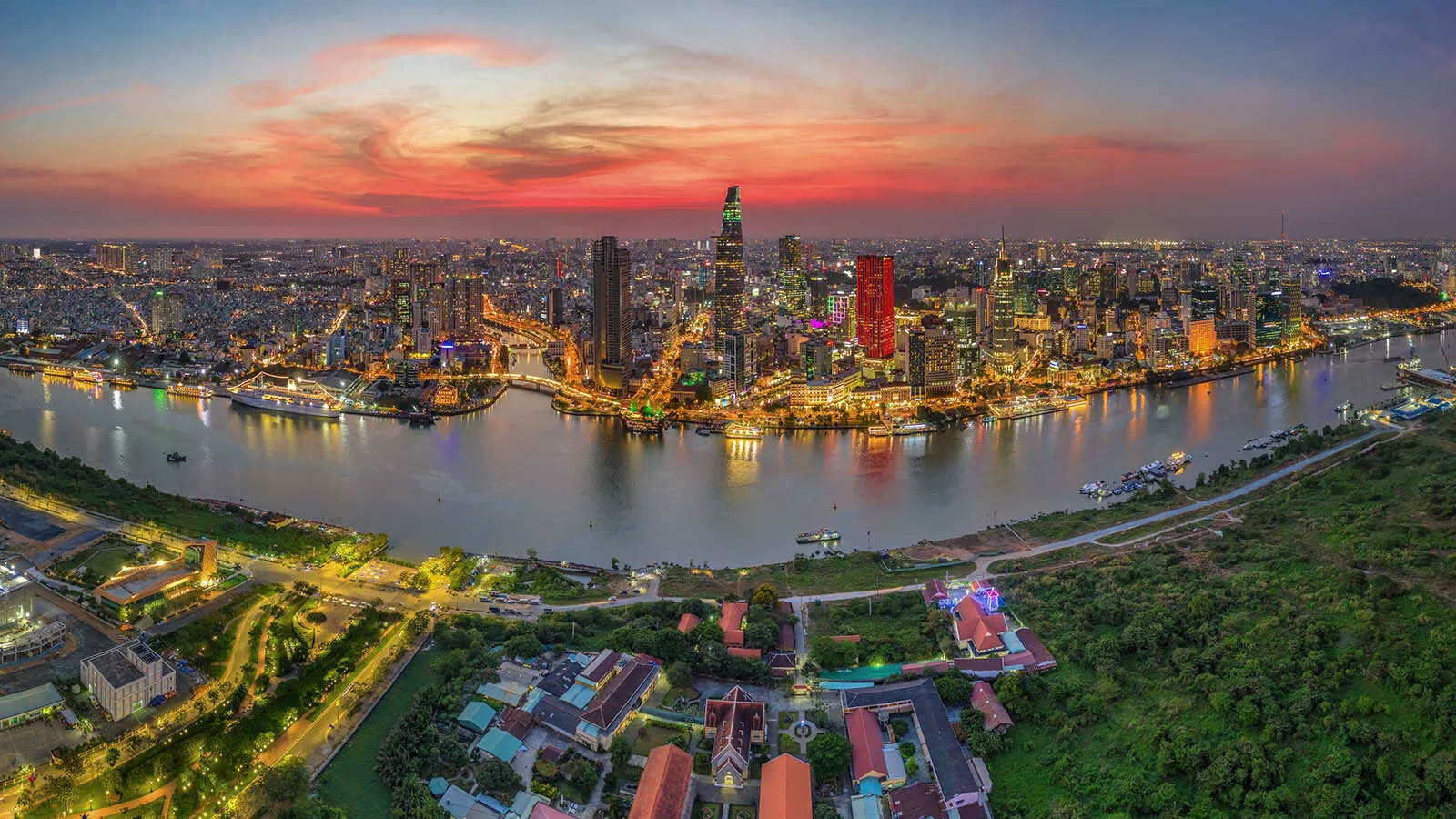 Sunset paints the skyline above the Saigon River